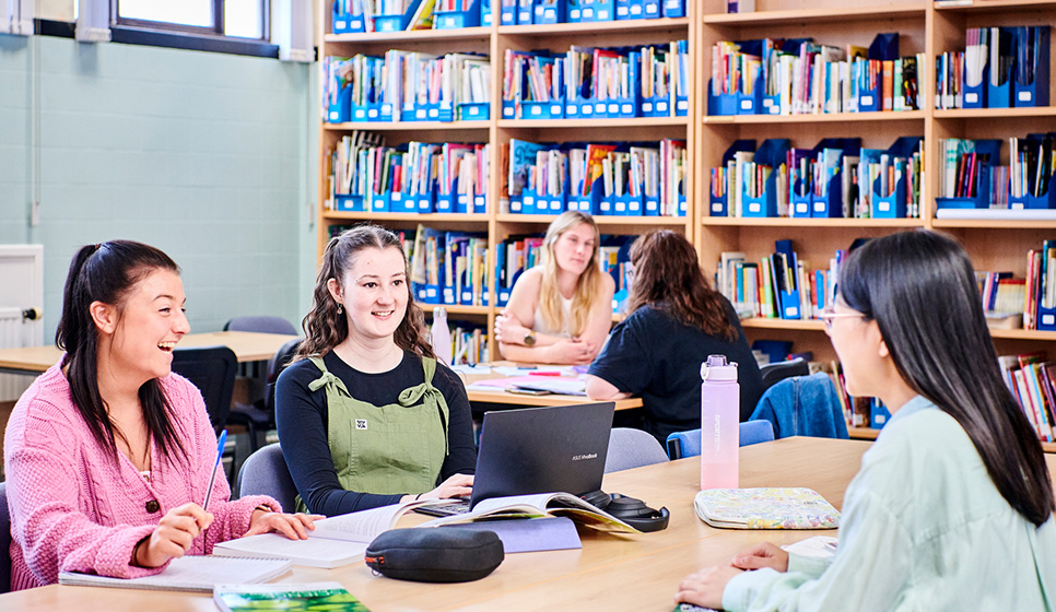 Students working in a library